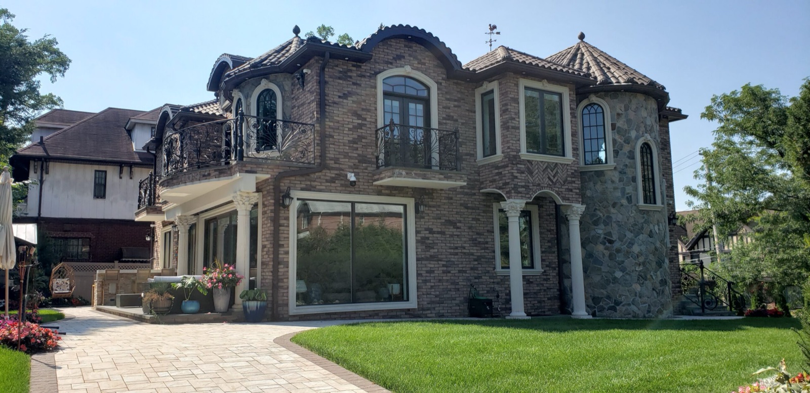 Two-story brick residence with arched windows